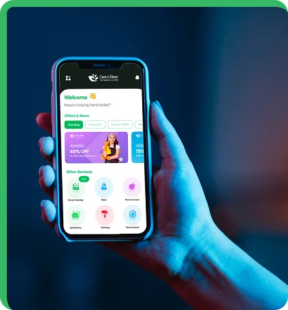 worker hanging an performing cleaning on windows of a tall building